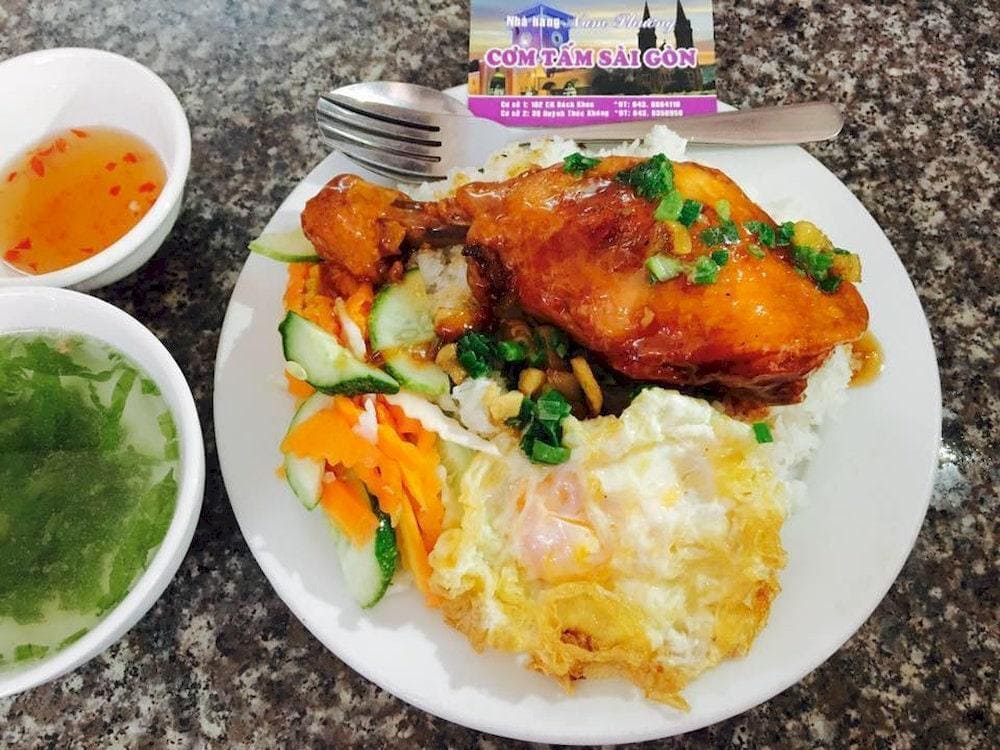 A clean, air-conditioned restaurant delivering rich Saigon-style broken rice with balanced flavors and fresh ingredients (Source: Fanpage Com Tam Nam Phuong)